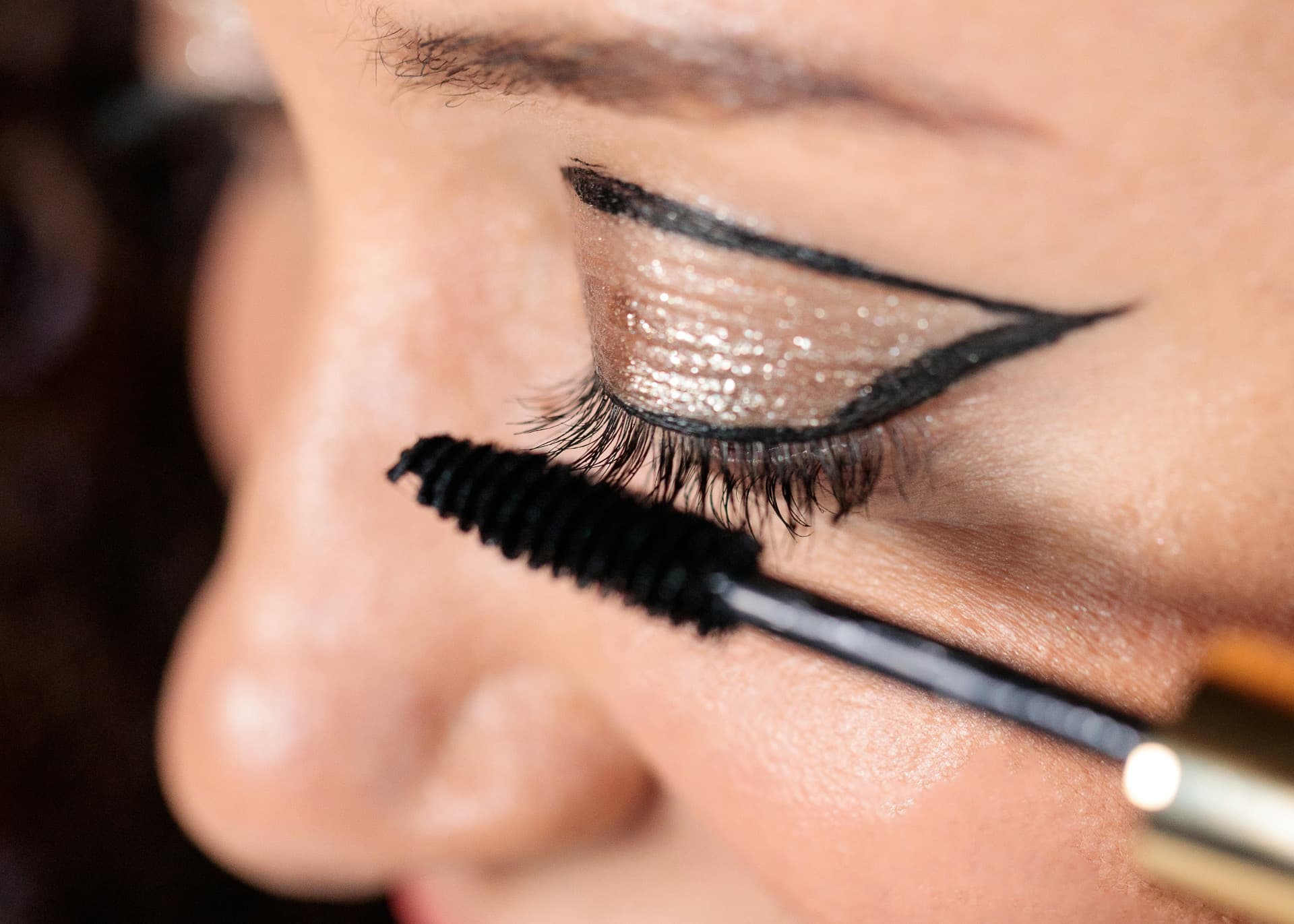 Mascara application — precision eye makeup artistry